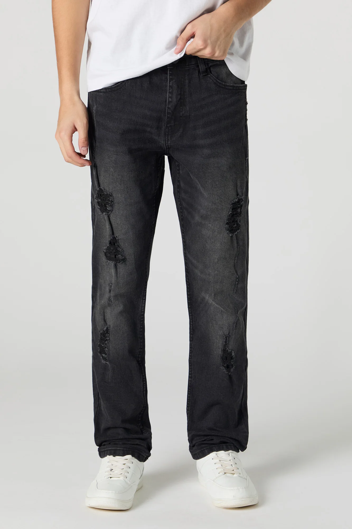 Jean mince en denim extensible d'aspect usé délavé noir